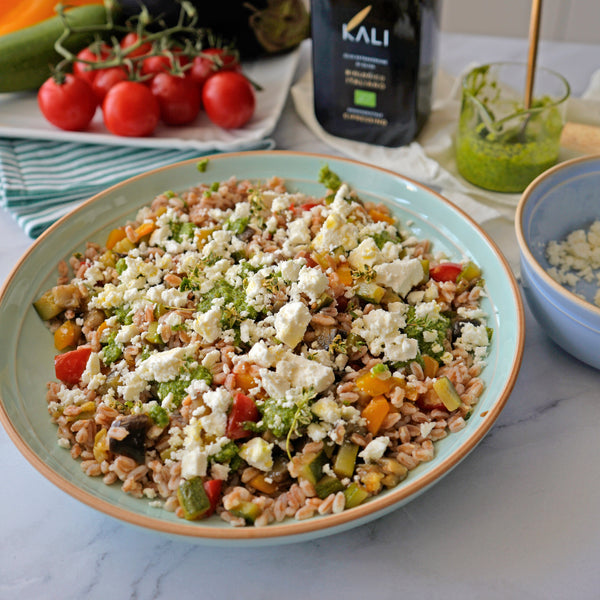Farro with seasonal vegetables, arugula pesto and feta